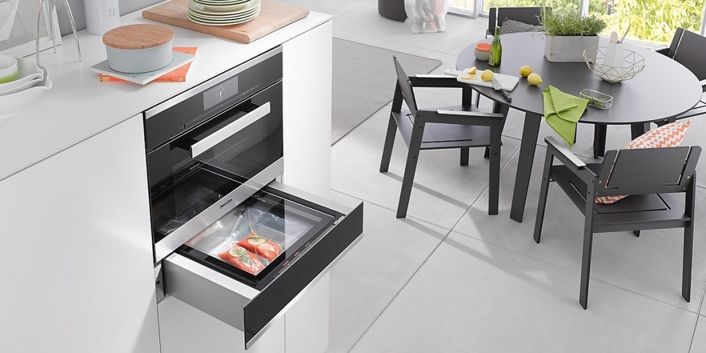 Cabinets for heating dishes and vacuuming Miele